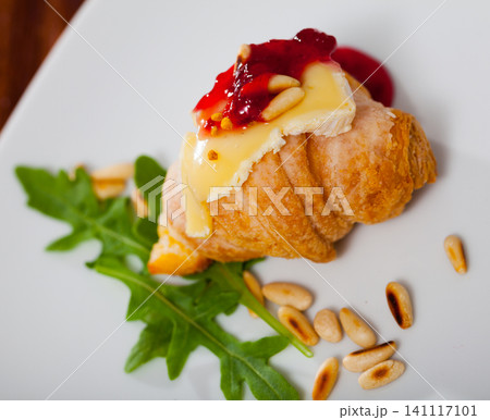 Camembert on mini croissant with jam, pine nuts 141117101