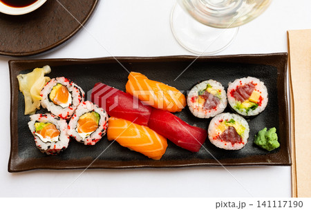 Popular Japanese dish sushi combo, which includes of Uramakis, Makis and Nigiris 141117190