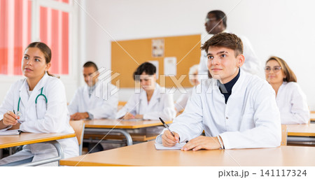 Medical students attending lecture in university 141117324