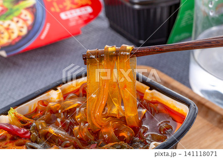 close-up of a self-heating spicy instant hot pot. close-up of a self-heating spicy instant hot pot. 141118071