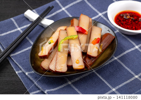 traditional Chinese spiced firm tofu salad with chili and tomato on a rustic wooden tray, authentic Asian appetizers. 141118080