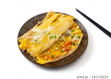 northeast Chinese street food grilled cold noodles with egg and scallions, isolated on white northeast Chinese street food grilled cold noodles with egg and scallions, isolated on white 141118224