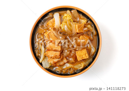 braised flat sweet potato glass noodles with fried tofu and cabbage in a ceramic bowl braised flat sweet potato glass noodles with fried tofu and cabbage in a ceramic bowl 141118273