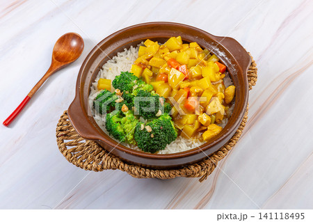 Chinese Curry Chicken Claypot Rice Casserole with Vegetables, Top View Chinese Curry Chicken Claypot Rice Casserole with Vegetables, Top View 141118495