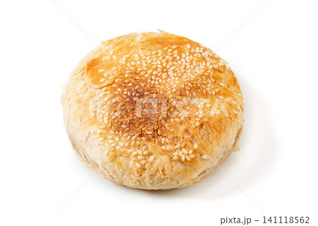 Traditional Chinese crispy baked shaobing flatbread topped with white sesame seeds 141118562