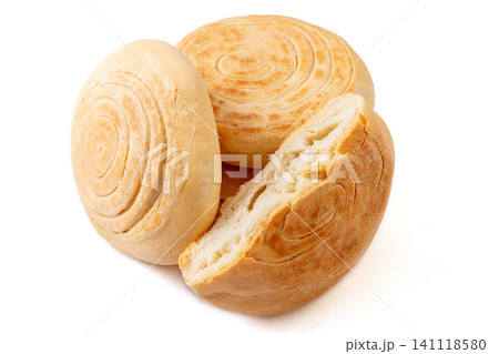 A stack of traditional Chinese Shaanxi style baked baijimo flatbread buns, isolated A stack of traditional Chinese Shaanxi style baked baijimo flatbread buns, isolated 141118580