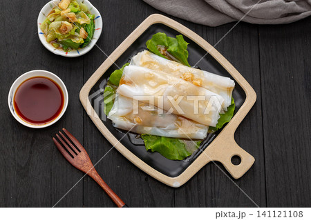 Cantonese dim sum steamed rice noodle rolls with sweet soy sauce and lettuce Cantonese dim sum steamed rice noodle rolls with sweet soy sauce and lettuce 141121108