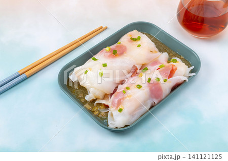 Steamed rice noodle rolls with Chinese sausage slices on plate 141121125