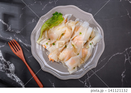 Cantonese dim sum steamed rice noodle rolls with shrimp and fresh lettuce 141121132