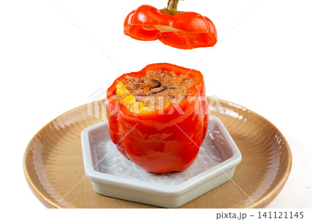 homemade stuffed bell peppers with rice and minced meat served on a plate. homemade stuffed bell peppers with rice and minced meat served on a plate. 141121145