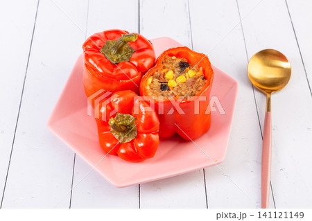 healthy delicious stuffed sweet peppers with savory rice filling, close up. healthy delicious stuffed sweet peppers with savory rice filling, close up. 141121149