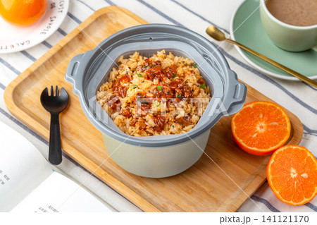 self-heating instant claypot rice with pork and savory sauce in container, convenient meal. self-heating instant claypot rice with pork and savory sauce in container, convenient meal. 141121170