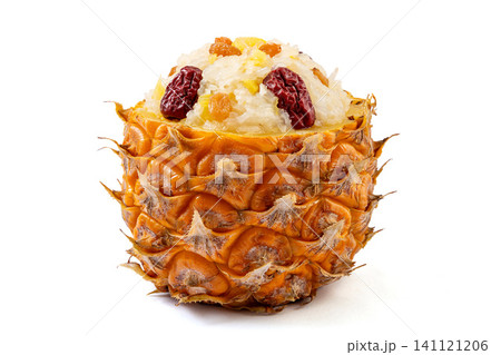 sweet pineapple sticky rice with jujube and raisins served in a whole pineapple shell. sweet pineapple sticky rice with jujube and raisins served in a whole pineapple shell. 141121206