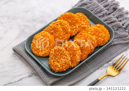 golden crispy pumpkin biscuits served with sweet sauce drizzle, traditional Asian dessert. golden crispy pumpkin biscuits served with sweet sauce drizzle, traditional Asian dessert. 141121222