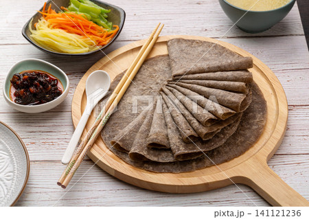 healthy Chinese buckwheat pancakes stack on plate, gluten free grain flatbread healthy Chinese buckwheat pancakes stack on plate, gluten free grain flatbread 141121236