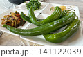 Chili peppers with side dishes on the table 141122039