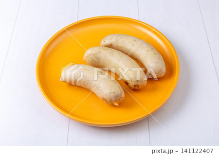 thuringian Style Sausages on Yellow Plate, German-Inspired Cuisine thuringian Style Sausages on Yellow Plate, German-Inspired Cuisine 141122407
