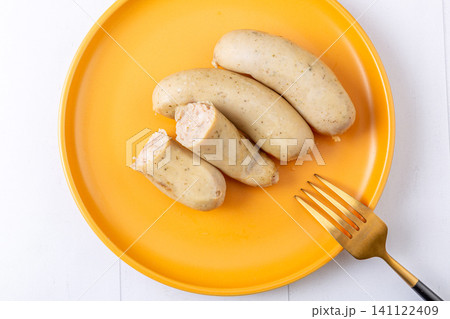 thuringian Style Sausages on Yellow Plate, German-Inspired Cuisine thuringian Style Sausages on Yellow Plate, German-Inspired Cuisine 141122409