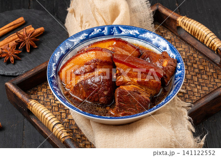 traditional Chinese Braised Pork Belly served in Ceramic Bowl on Wooden Tray traditional Chinese Braised Pork Belly served in Ceramic Bowl on Wooden Tray 141122552