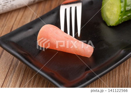 sliced round ham sausage with fresh strawberry and lettuce on black slate sliced round ham sausage with fresh strawberry and lettuce on black slate 141122566