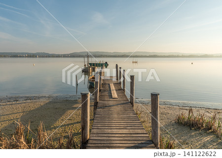 Wooden jetty with boats on Lake Constance, Germany 141122622