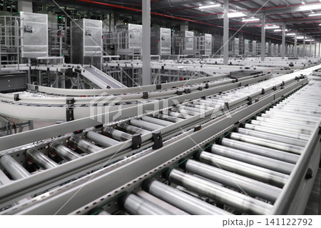 packing line in a logistics warehouse. conveyor belt in a modern production line. Pallet racking 141122792