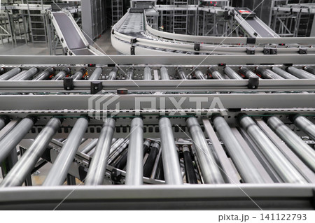 packing line in a logistics warehouse. conveyor belt in a modern production line. Pallet racking 141122793