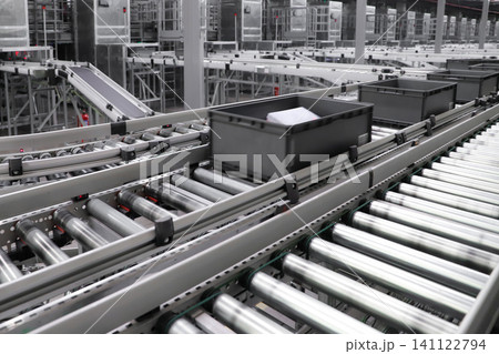 packing line in a logistics warehouse. conveyor belt in a modern production line. Pallet racking 141122794