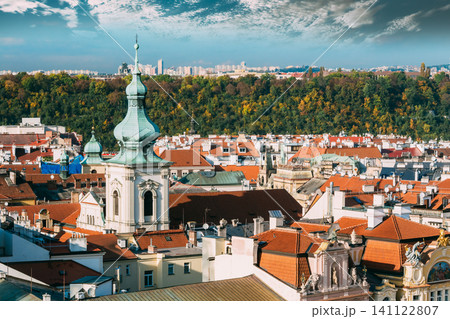 The green dome of St. Nicholas Church rising above Prague rooftops. 141122807