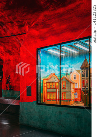 Solna Centrum metro station with red walls and painted mural of houses, Stockholm Solna Centrum metro station with red walls and painted mural of houses, Stockholm 141122825