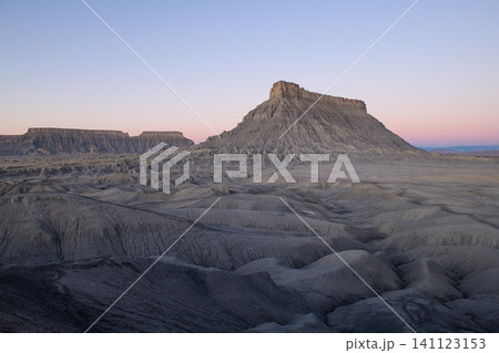 Majestic mesa desert landscape with impressive geology rock formation and vast mountain scenery. Outdoor nature view in utah usa evokes peaceful and tranquil feeling at twilight 141123153