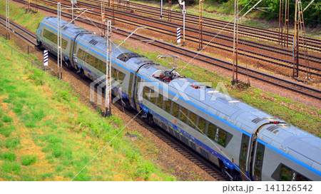 Warsaw, Poland. 6 July 2026. Passenger train of public transport on railroad track. Warsaw, Poland. 6 July 2026. Passenger train of public transport on railroad track. 141126542