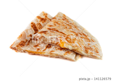 Delicious quesadilla with melted cheese side view close up on white background with copy space savory mexican snack food for take out or delivery Delicious quesadilla with melted cheese side view close up on white background with copy space savory mexican snack food for take out or delivery 141126579