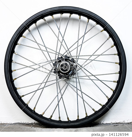 Black motorcycle wheel rim with silver spoke and hub isolated on white background for custom motorbike tuning and spare part replacement equipment Black motorcycle wheel rim with silver spoke and hub isolated on white background for custom motorbike tuning and spare part replacement equipment 141126594