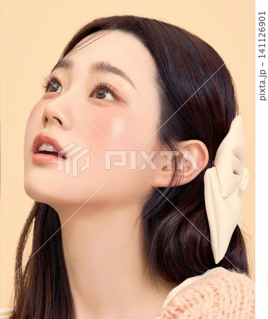 Beautiful Young Asian Woman with Natural Healthy Glowing Skin and Smooth Black Hair, Fresh Beauty Portrait on Clean Background Beautiful Young Asian Woman with Natural Healthy Glowing Skin and Smooth Black Hair, Fresh Beauty Portrait on Clean Background 141126901