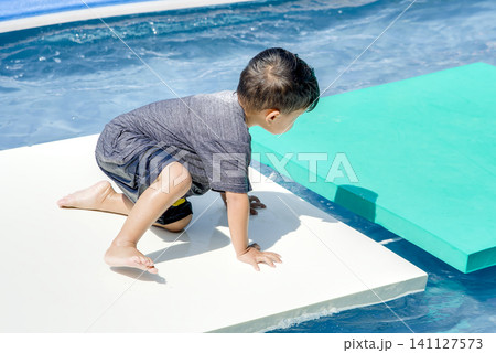 Child Splashing in Water Playground Pool Child Splashing in Water Playground Pool 141127573