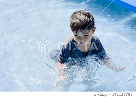 asian boy swimming in the pool 141127798