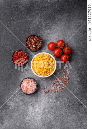 Golden, sweet canned corn kernels or maize for salads and vegetarian dishes. Canned corn Golden, sweet canned corn kernels or maize for salads and vegetarian dishes. Canned corn 141127919