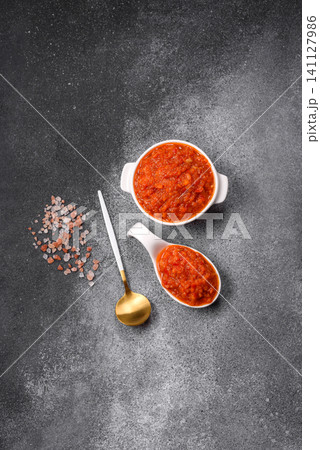 Red tomato Bolognese sauce with spices, salt, pepper, and herbs. A red sauce Red tomato Bolognese sauce with spices, salt, pepper, and herbs. A red sauce 141127986