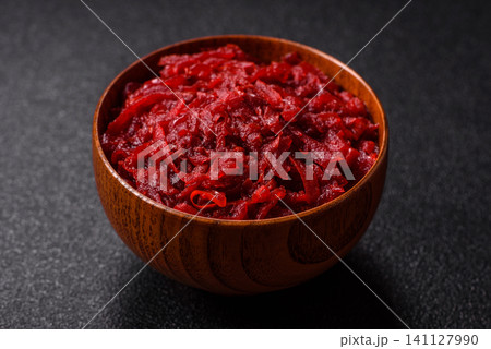 Grated beetroot with salt and spices as an ingredient for borscht or a vegan salad. Grated beetroot 141127990