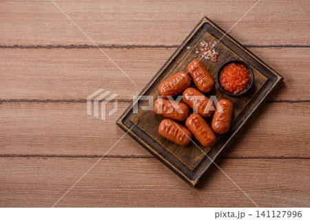Chicken or pork grilling sausages with garlic, salt, and spices. Grilling sausages 141127996