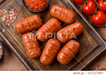 Chicken or pork grilling sausages with garlic, salt, and spices. Grilling sausages Chicken or pork grilling sausages with garlic, salt, and spices. Grilling sausages 141127997