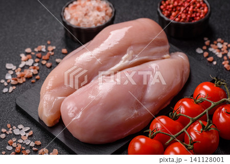 Fresh raw chicken fillet with salt and spices for home cooking. Raw chicken fillet 141128001