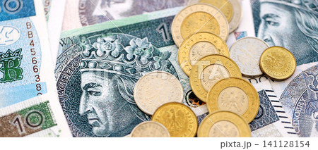 Big amount of polish zloty money banknotes and grosz coins close up. Huge pile of cash of Poland currency. Concept of business, economy and investment in Poland Big amount of polish zloty money banknotes and grosz coins close up. Huge pile of cash of Poland currency. Concept of business, economy and investment in Poland 141128154