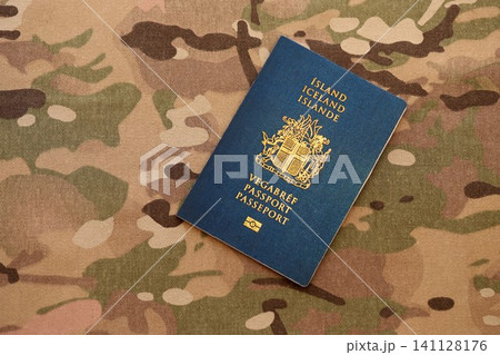 Icelandic passport on table close up. Official identification document book for citizens of Iceland. Concept of travel and tourism in Iceland 141128176