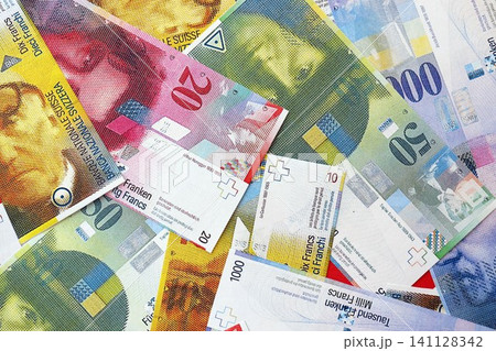 Swiss franc banknotes. The current francs money bills lies on table in big amount 141128342
