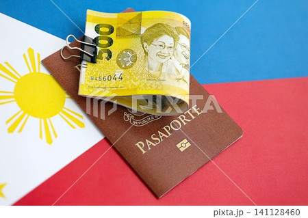 Philippines peso currency money bills and passport lies on flag. The concept of travel and vacation 141128460