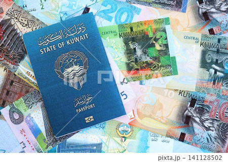 Kuwaiti dinar currency money bills and passport. The concept of travel and vacation Kuwaiti dinar currency money bills and passport. The concept of travel and vacation 141128502