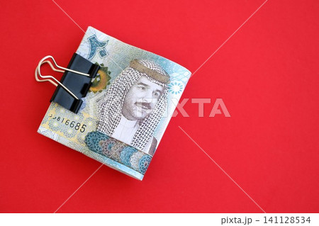 Bahraini dinar money bills in big amount on red. Finance and banking concept Bahraini dinar money bills in big amount on red. Finance and banking concept 141128534