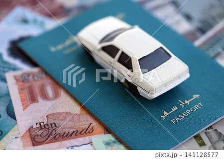 Egyptian pound currency money bills and car with passport. The concept of car ownership 141128577